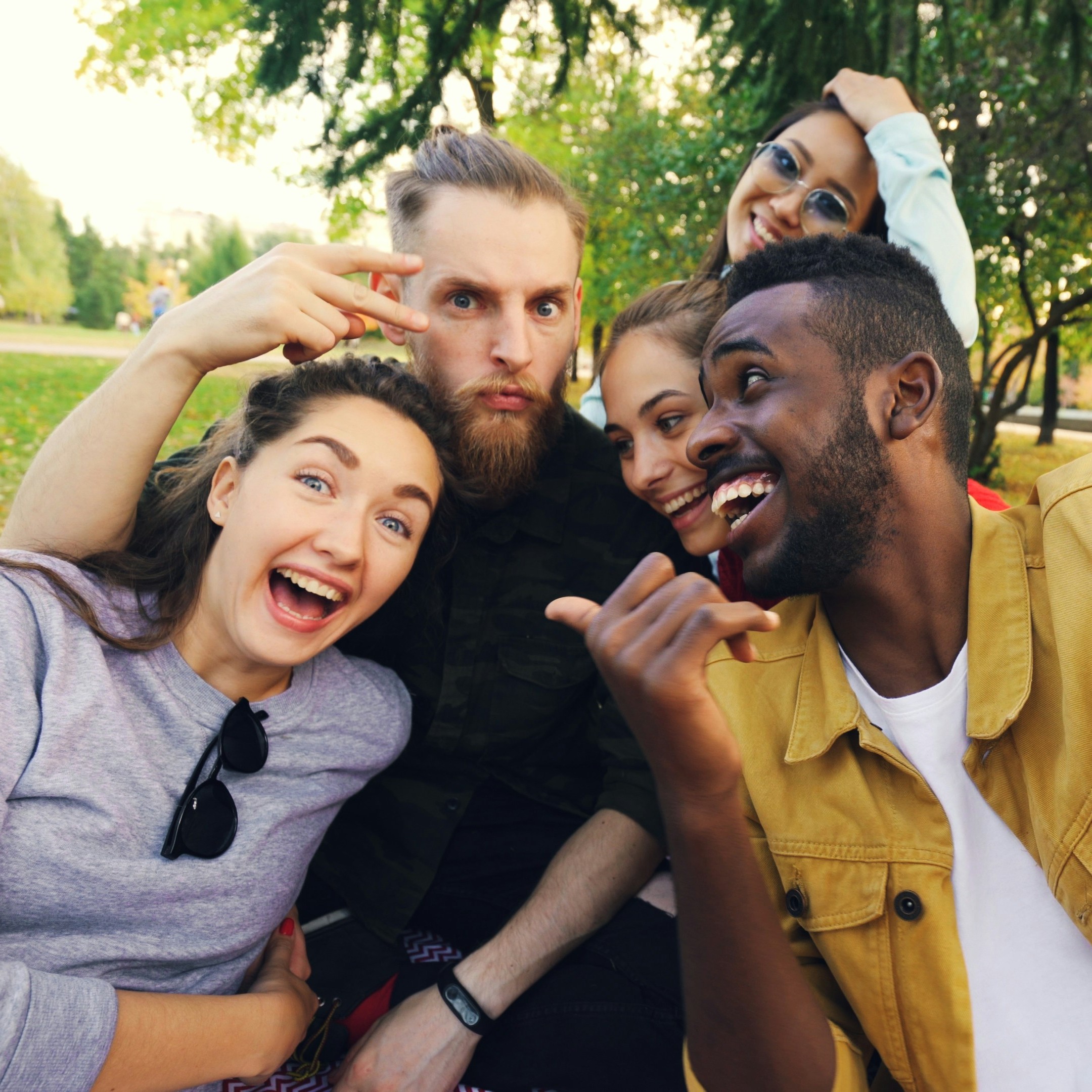Friends sharing photos at an outdoor gathering